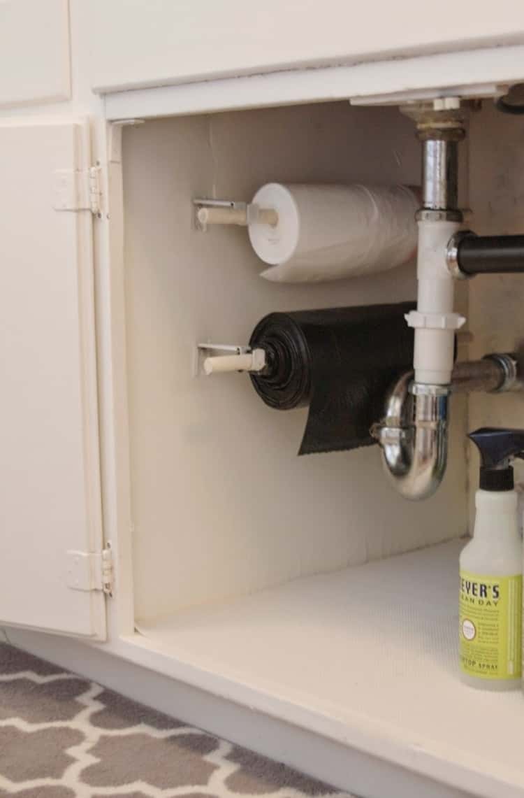 Trash bags on rolls storage under sink storage