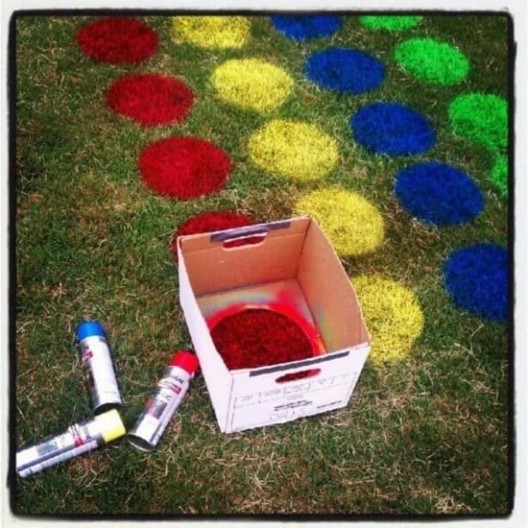 Spray paint used to create the game Twister on the yard