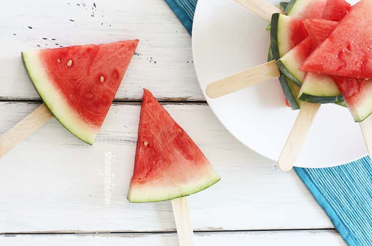 Genius picnic hacks - watermelons put on popsicle sticks to make them easier to eat and less messy