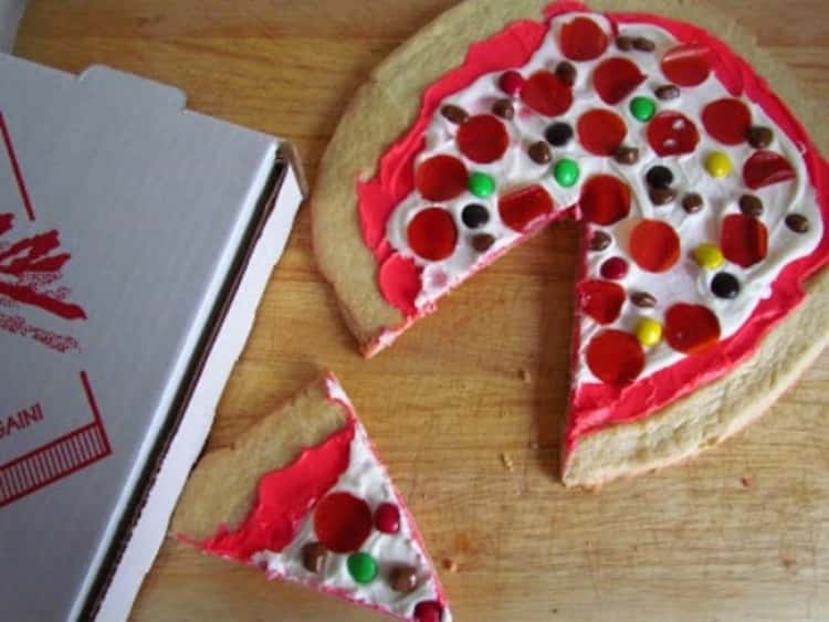 Pizza made from a sugar cookie crust, cream cheese and candy as toppings. Sweet! 