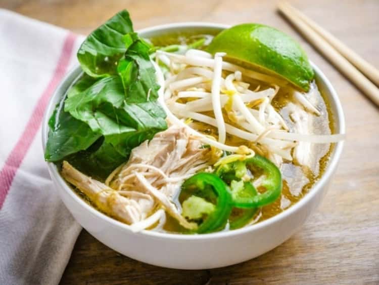 bowl of chicken faux pho soup with mung beans, a lime wedge and sliced jalapenos, Instant Pot Chicken Recipe