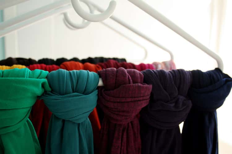 Scarves tied on hangers in the closet