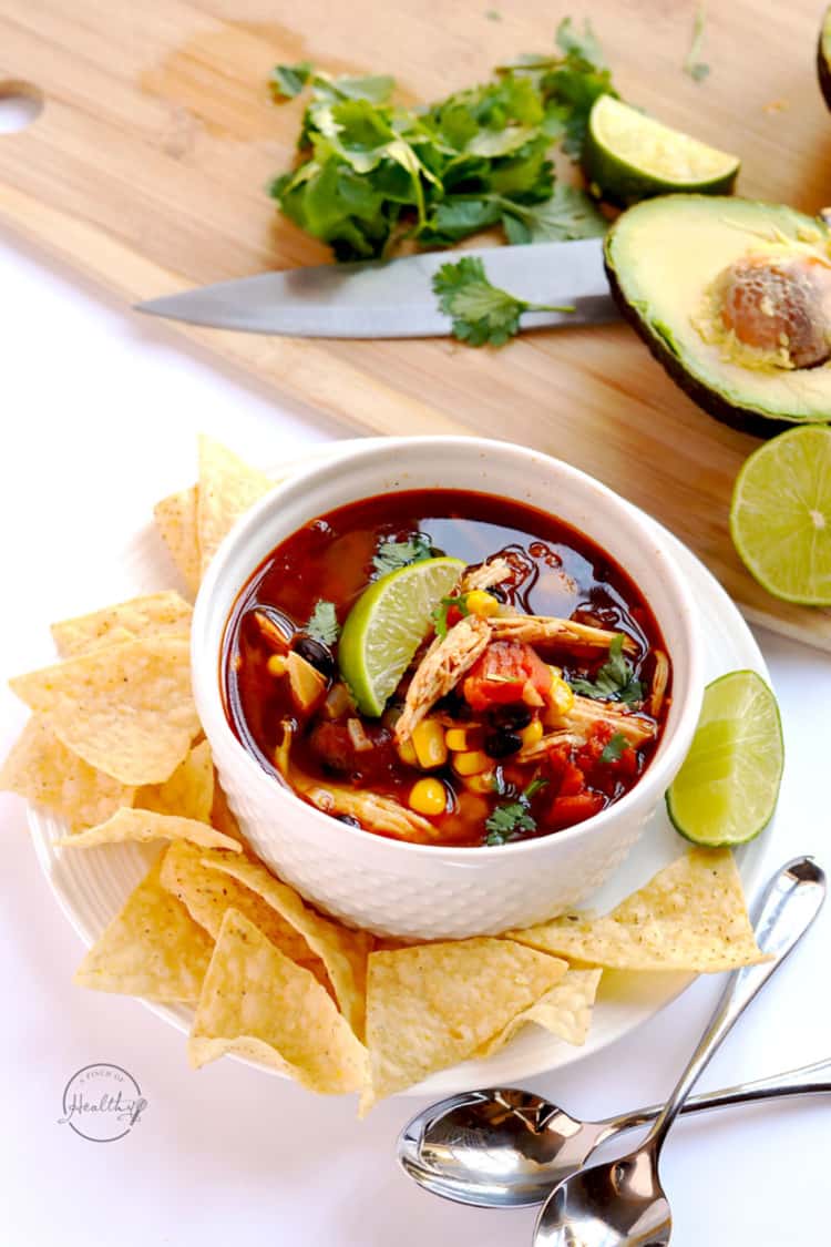 Instant Pot chicken tortilla soup in a bowl with tortilla chips and a lime wedge, Instant Pot Chicken Recipes 