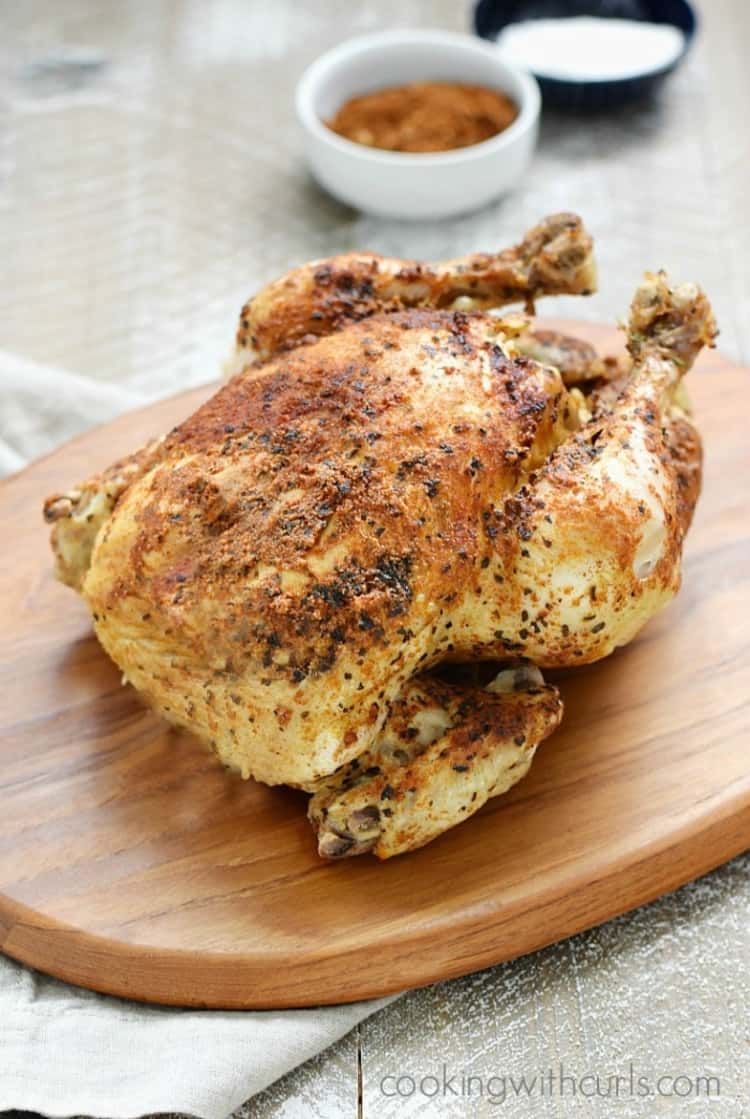 Instant Pot faux rotisserie chicken on a wooden platter