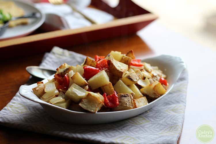 White oval dish with chunks of air-fried potatoes.