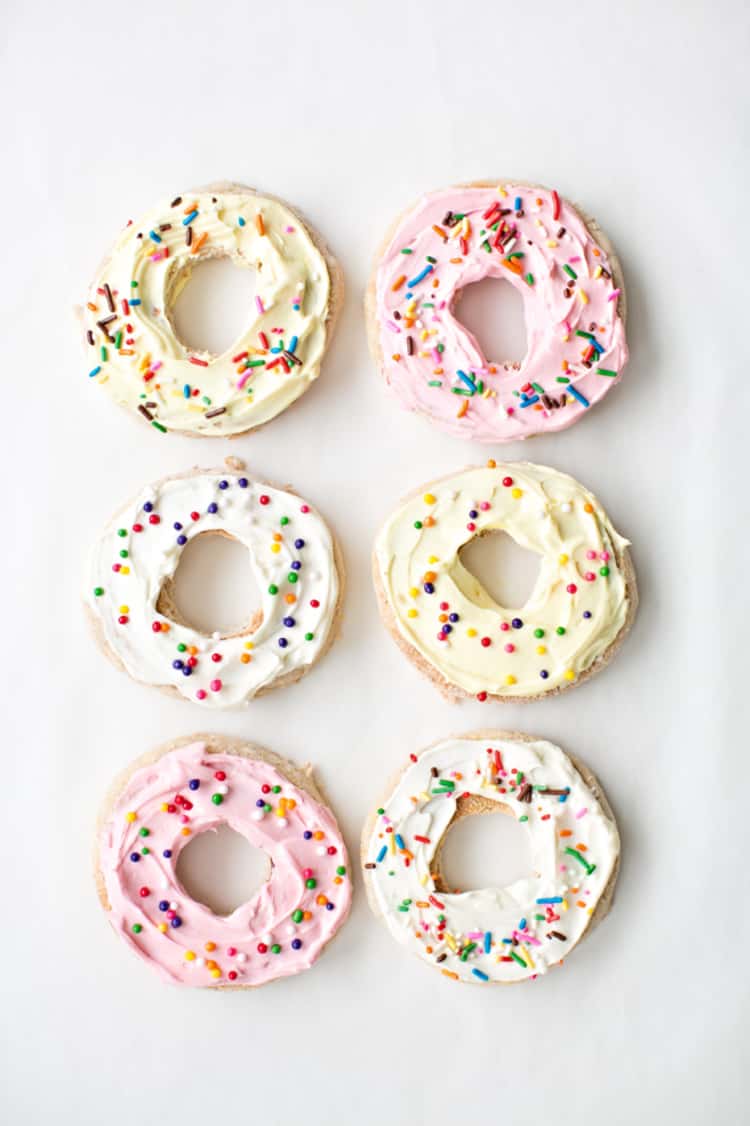 English muffins disguised as donuts with a bit of cream cheese frosting and sprinkles