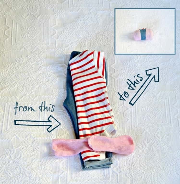 baby hack of rolling up baby's clothes and holding them in place with the socks. 