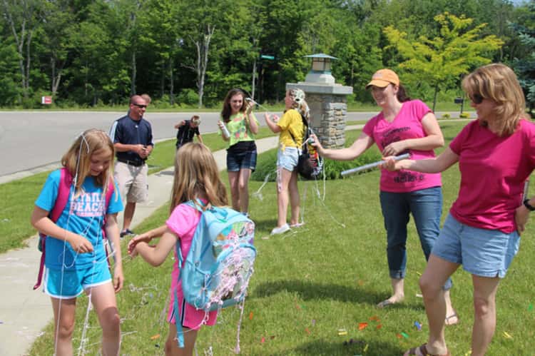 An after-school back-to-school traditions where the parents bombard their children with noisemakers, confetti, ribbons, and their favorite snacks