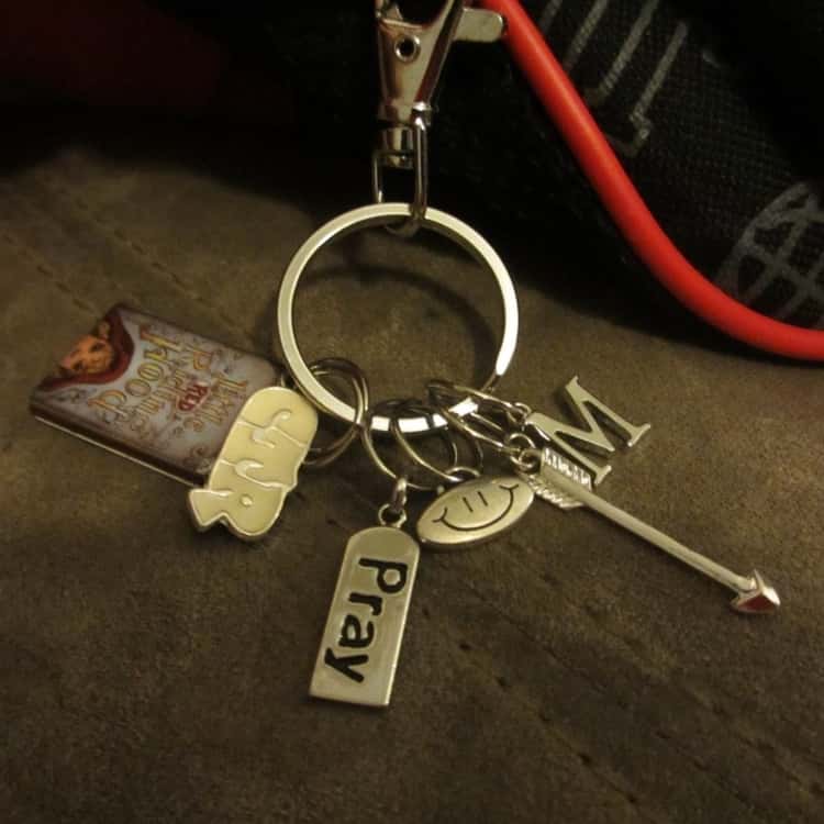 a silver backpack charm