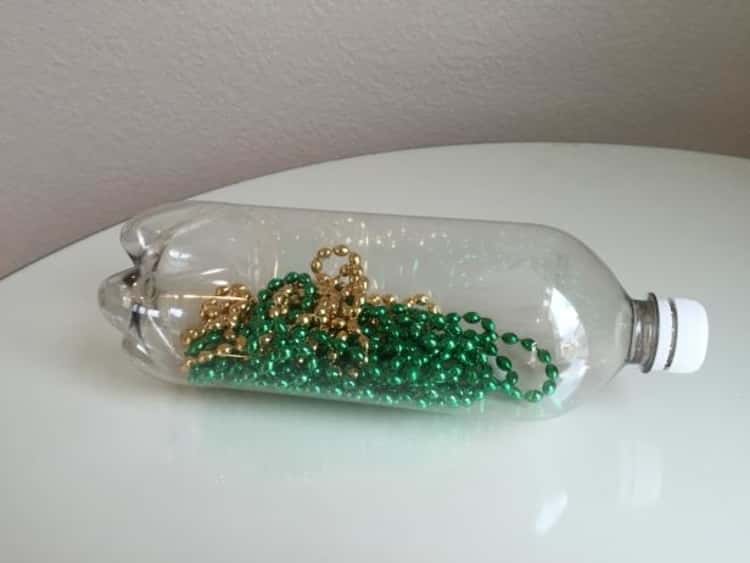 Store Christmass beads in a bottle