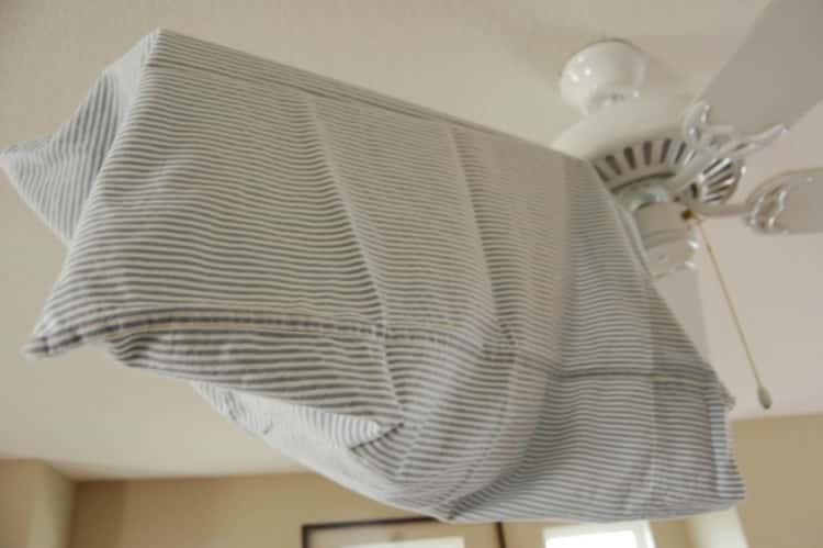 a pillowcase on a ceiling fan blade 