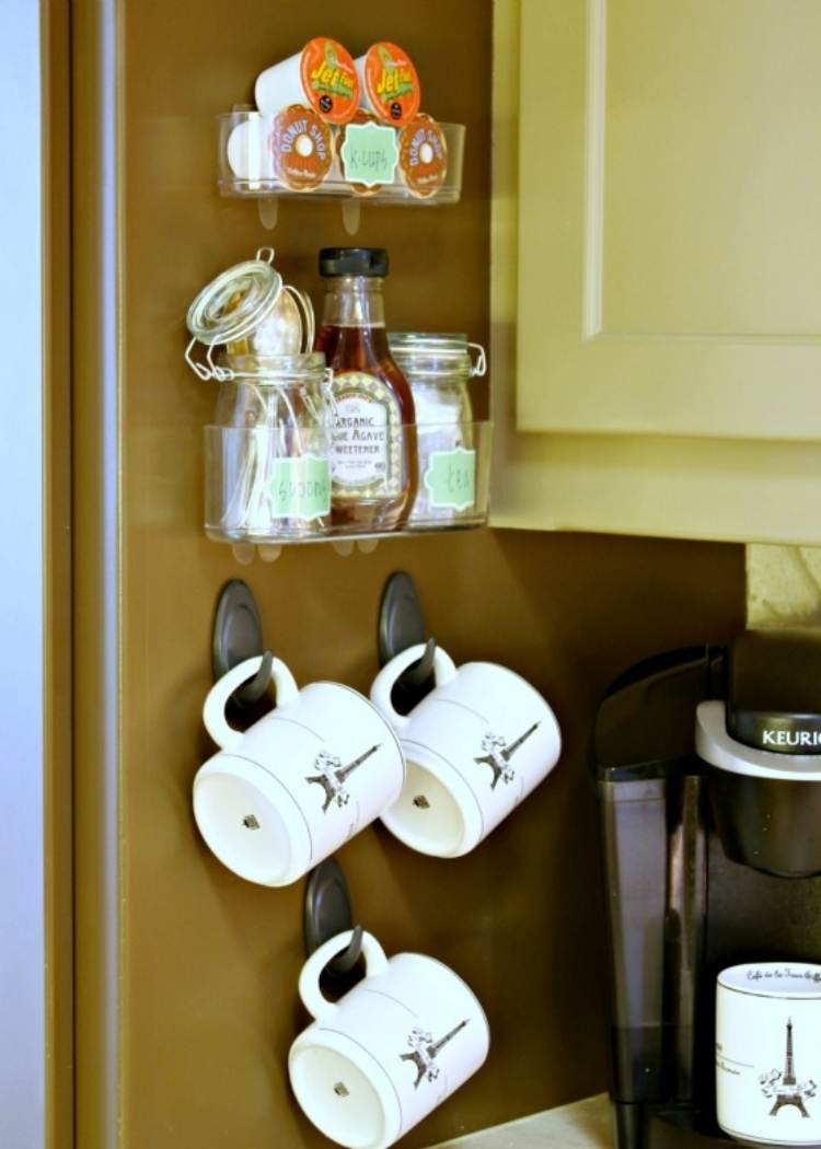 a coffee station on the side of the fridge 