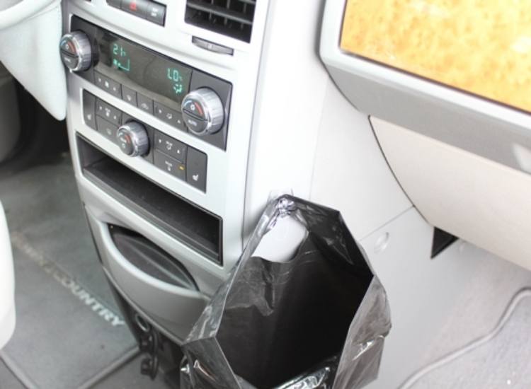 command hook to hang a trash bag in the car next to the passengers seat 