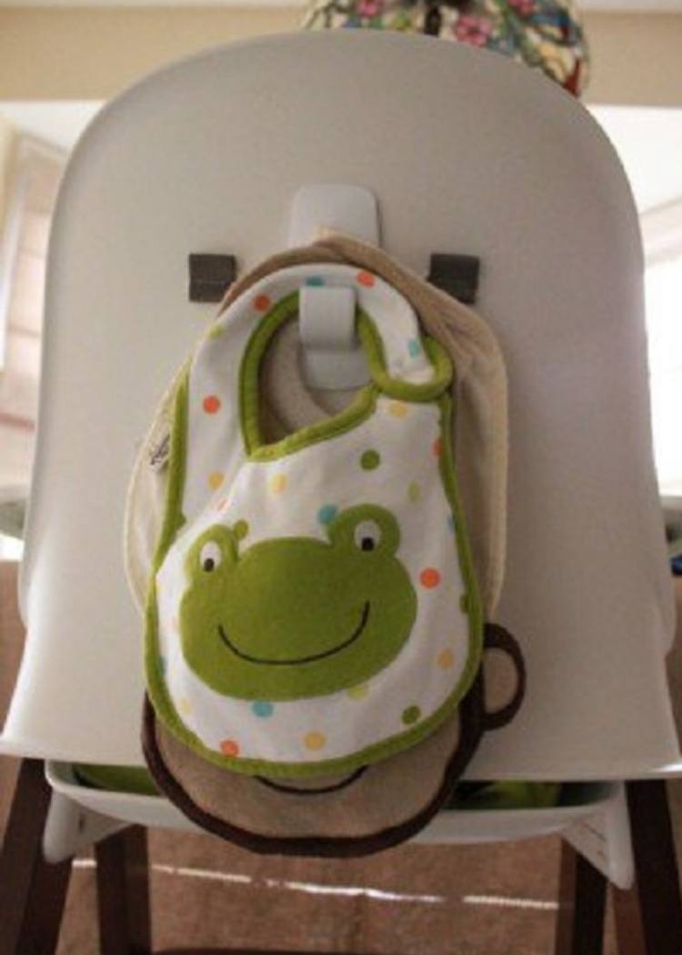 command hook to store baby bibs behind high chair back 