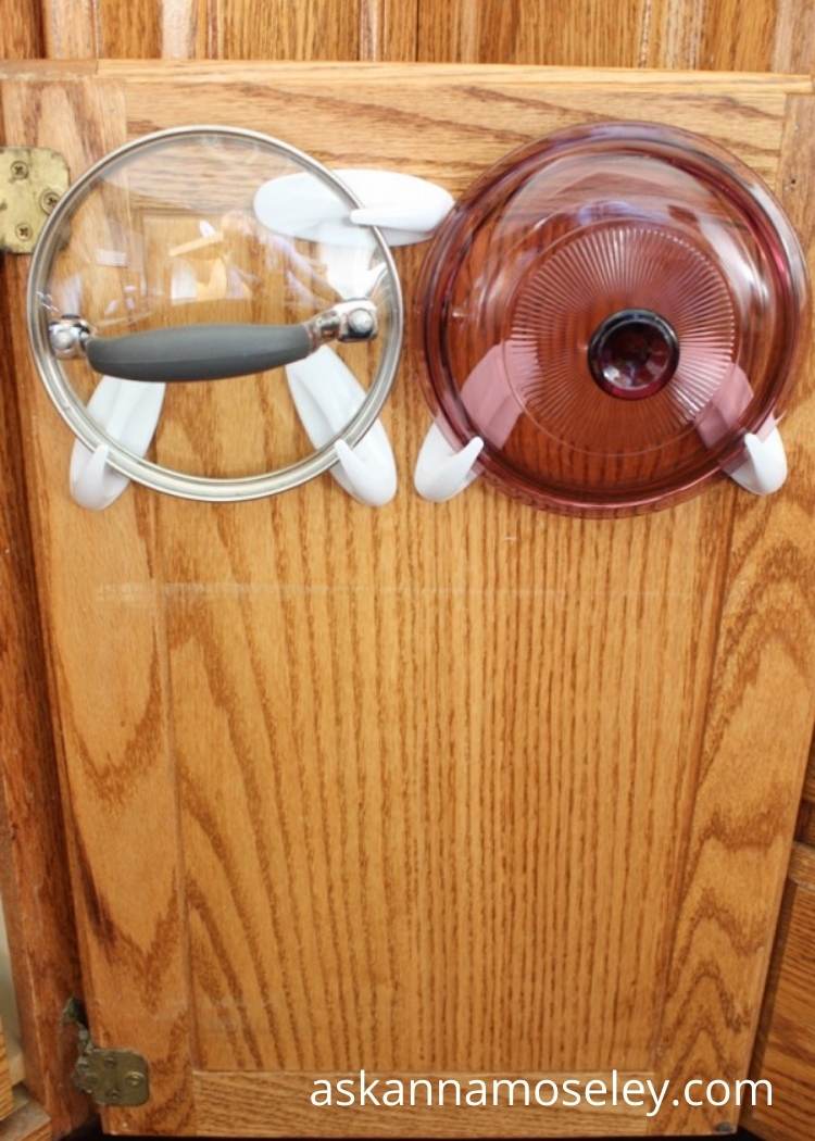 command hooks used store pot and pan lids inside the cupboard door