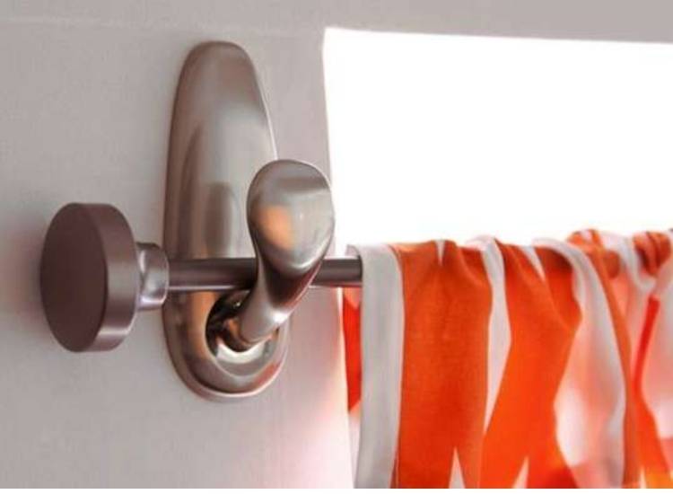 unusual use for command hooks to hand curtain rod in living room 