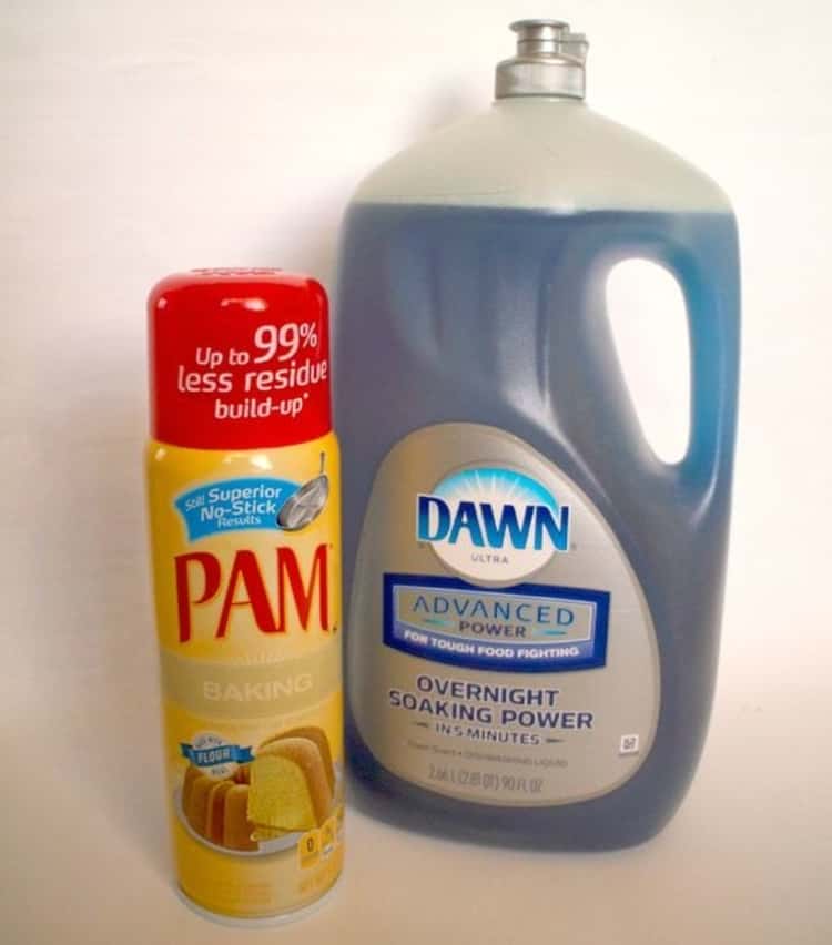 A can of cooking spray next to a jerrycan of dish detergent.