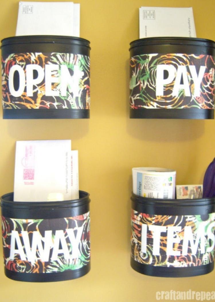 Formula Cannisters Labeled and adhered to the wall for mail sorters. Repurpose canisters into useable organizing baskets.