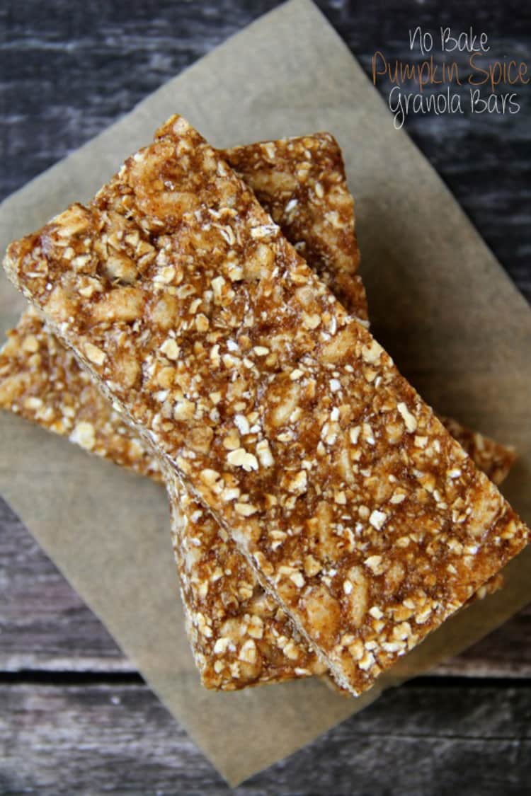 Features no-bake pumpkin spice granola bars stacked on wax paper.
