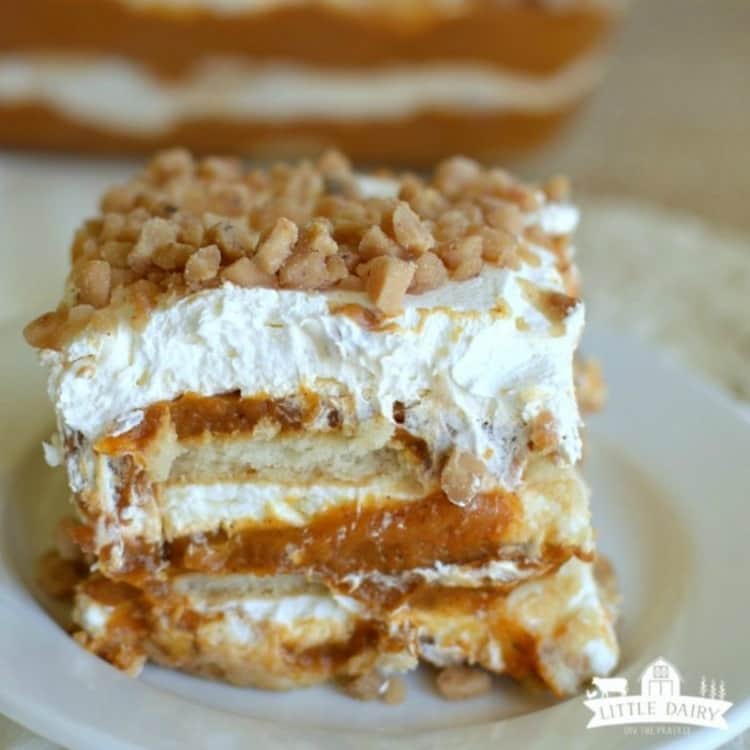 Photo of ice box cake featuring layers of pumpkin, toffee, and whipped cream and topped with toffee crunch goodness.