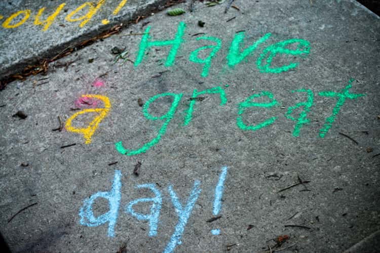 a sidewalk with a message written in chalk - Have a great day! 