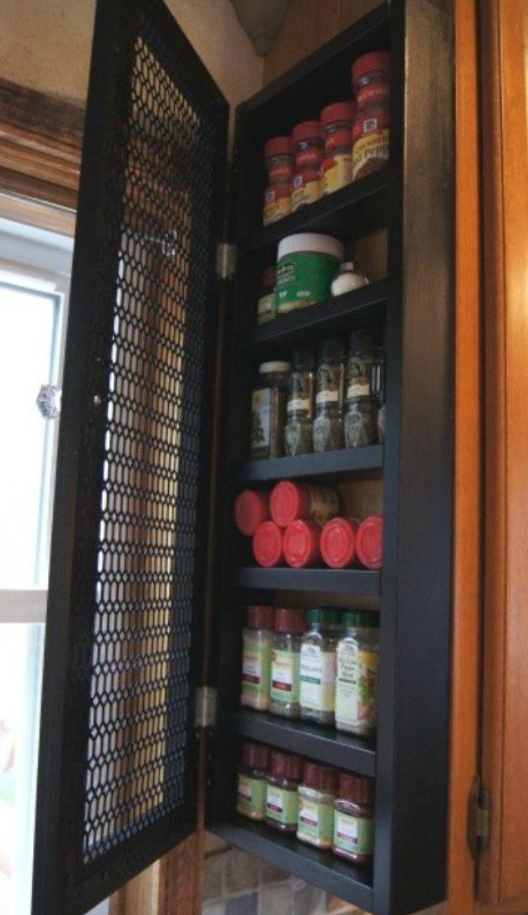 spices in an individual cabinet attached to the end of a pantry cabinet