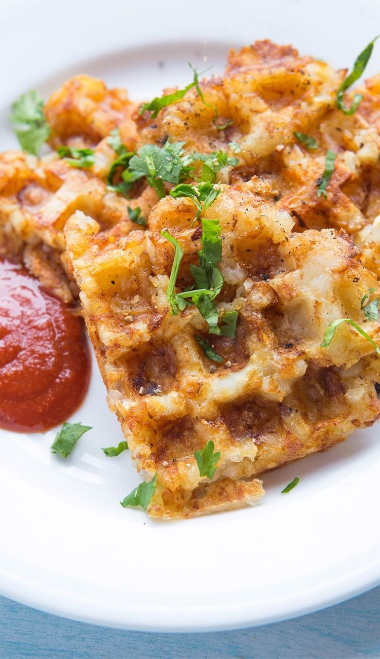 tator tot hashbrown waffles with a side of ketchup