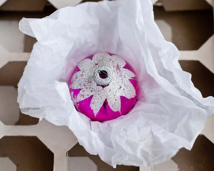 Wrap delicate ornaments in tissue paper