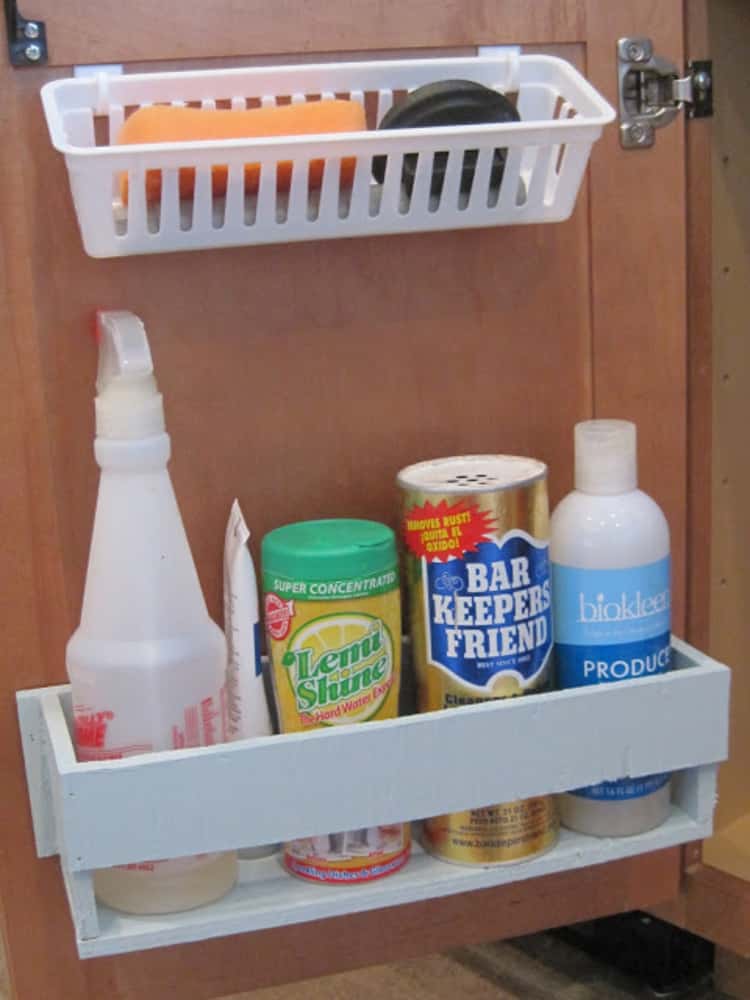 Baskets hanging from under sink cabinet door