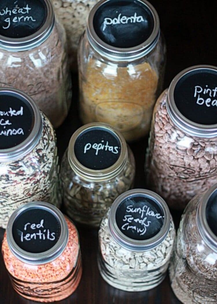 mason jars with chalkboard paint filled with rice, grains, lentils, quinoa, polenta