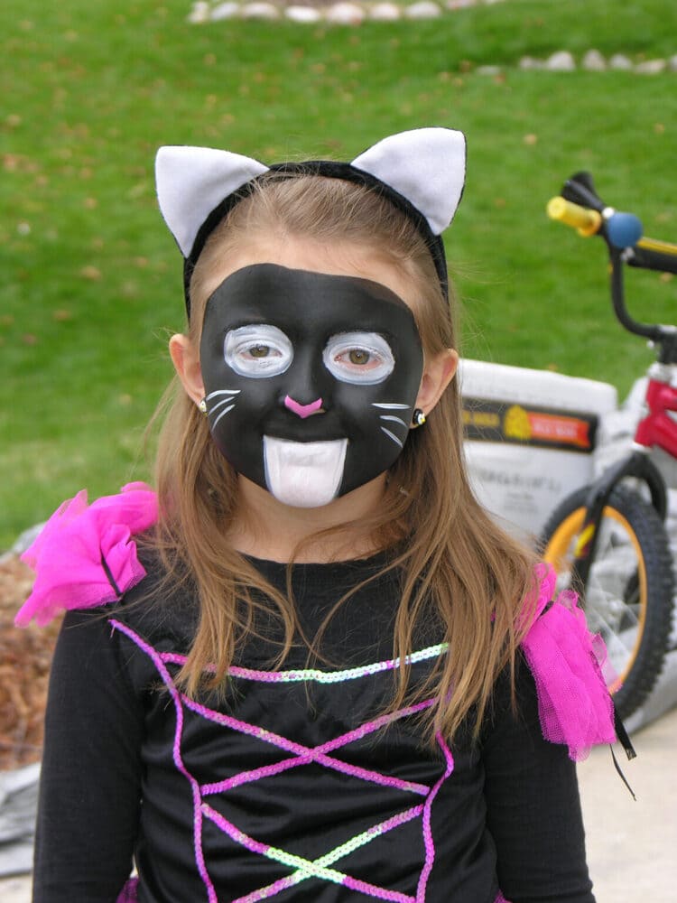 girl with black cat face paint