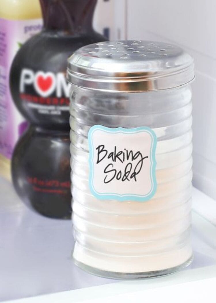 baking soda in a shaker jar, pom juice in the background