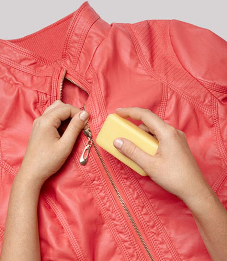 fixing stuck zipper on a red leather jacket with soap bar 