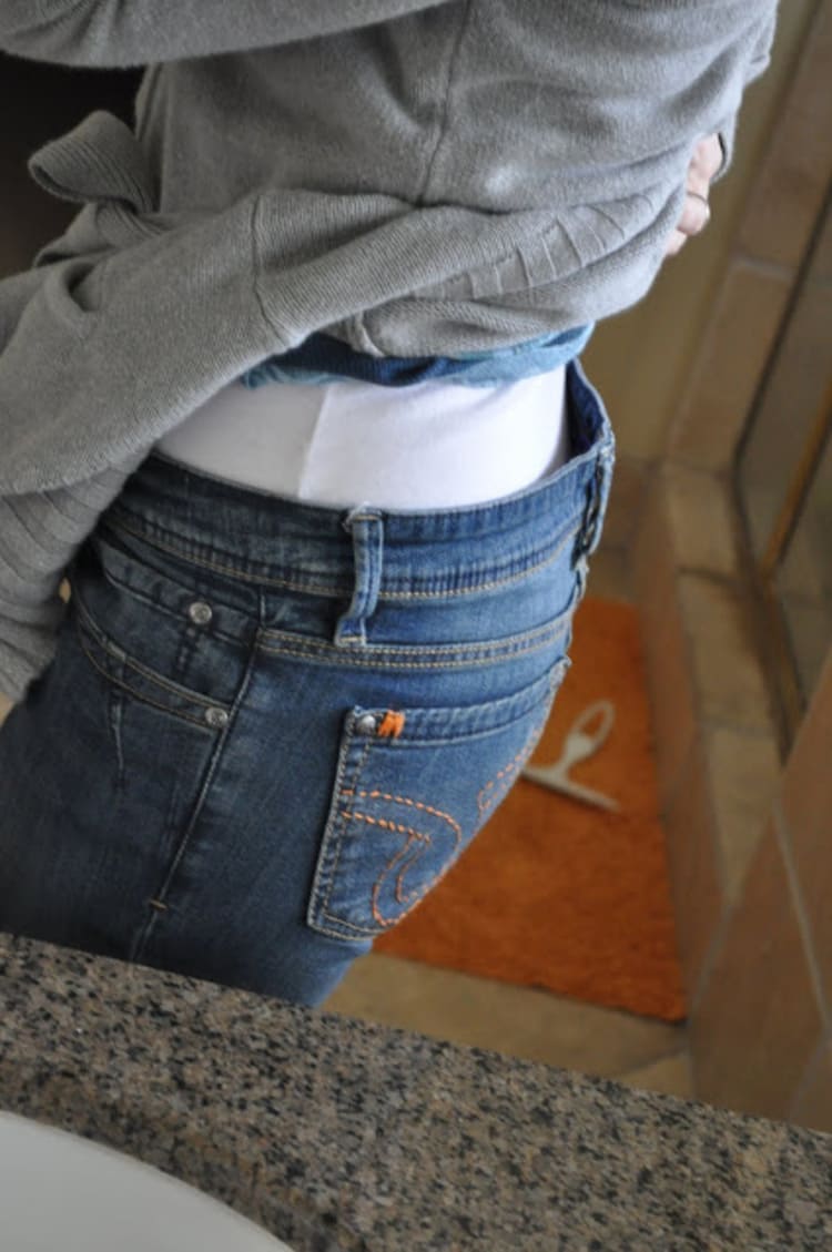 girl with jeans and white shirt with a gray top