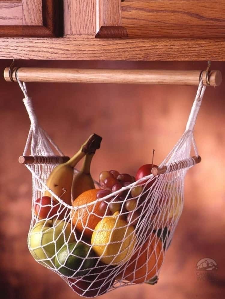 fruit hammock holding a variety of fruit