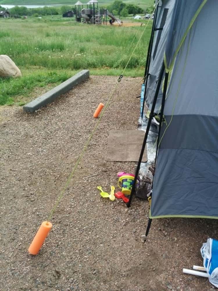 pool noodles used as tent line markers to keep from tripping over them