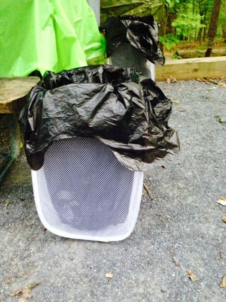 A hamper used as a pop up trash can