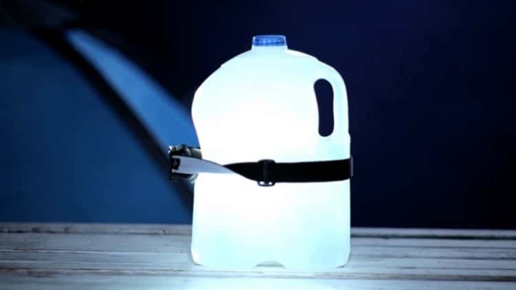 A gallon jug fitted with a headlamp to provide ambient light