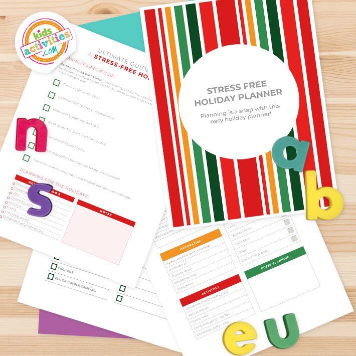 sample pages from a holiday planning journal with a colorful red, green and gold cover