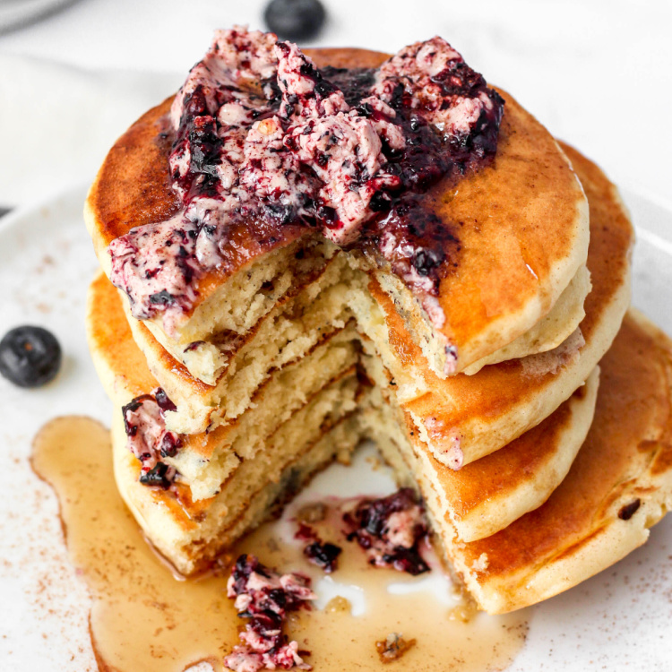 Stack of pancakes with blueberry butter.