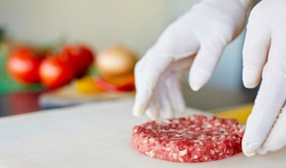Pair of white-gloved hands prepping a ground beef burger with tomatoes, onions, and peppers in the background - Clever BBQ Tips & Hacks to Save the Day - One Crazy House